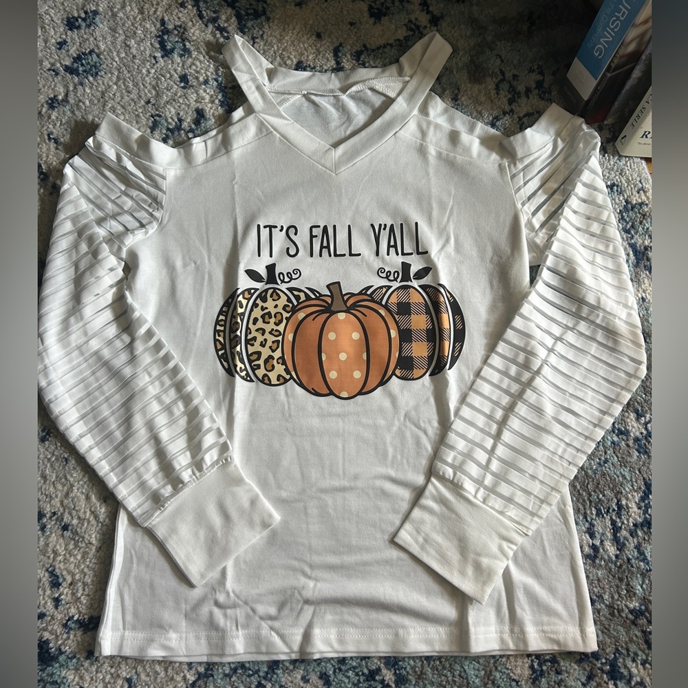 Cute off the shoulder fall shirt. Brand new! Sz small.